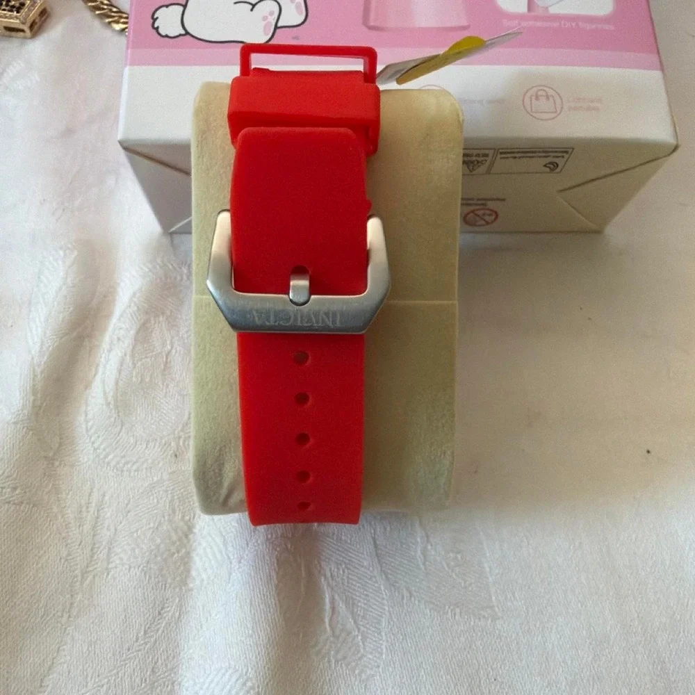 Invicta blue watch with white stripes on the band Blue, Red, yellow, Green